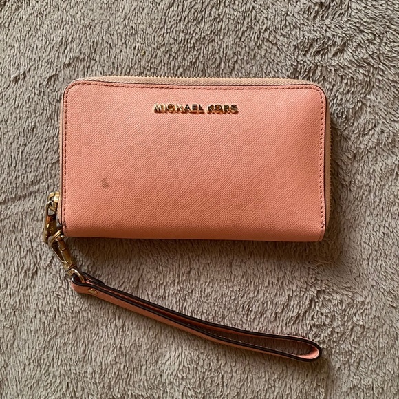 michael kors light pink wristlet/wallet